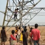 Worker Climbs High-Voltage Tower Amid Family Dispute, Rescued By Fire Brigade.