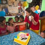 Celebrating Shreya’s Birthday By Spreading Joy & Happiness Among The Children Of Shree Aurobindo Ashram, Aralia Organised By Dr. Niti Sharma, GS Of Purvodaya.